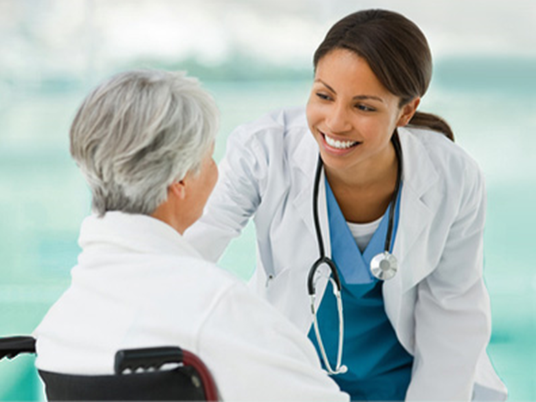 Dark haired women, healthcare worker with eldery women